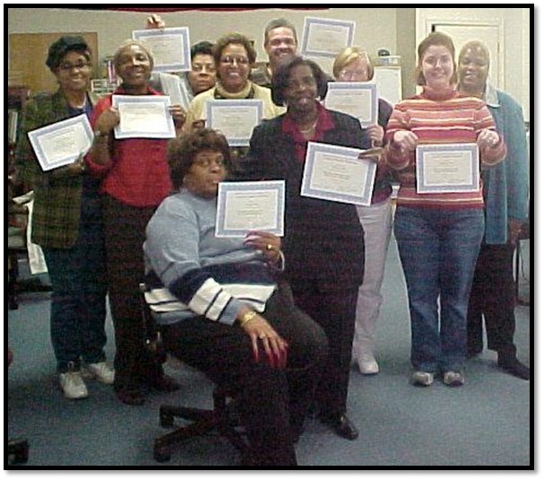 Students holding their certificates